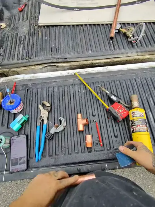 Through Jacob's glasses: copper fittings pushed together by hand on a tailgate