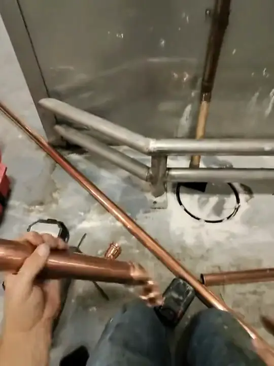 Through Jacob's glasses: copper pipe and press fittings being assembled